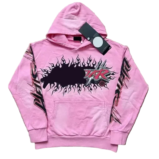 Pink hoodie with black graphic design on a wooden surface