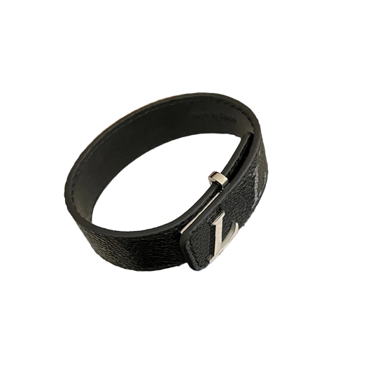 Black leather belt with silver buckle on a white background